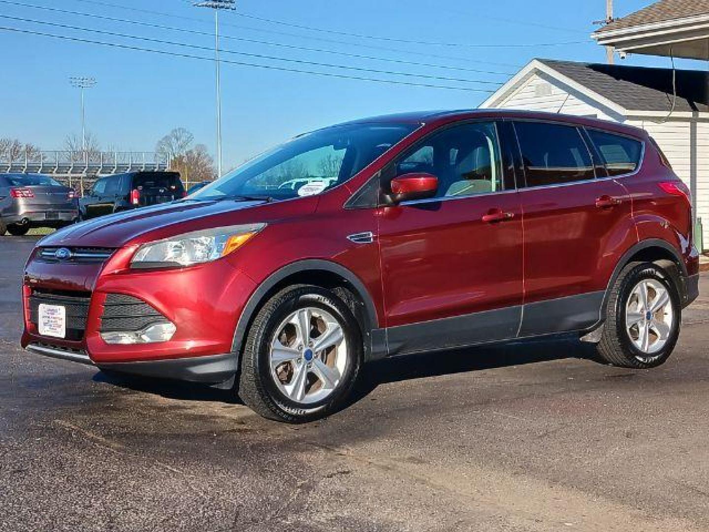 2014 Ruby Red Tinted CC Ford Escape SE FWD (1FMCU0G93EU) with an 2.0L L4 DOHC 16V engine, 6-Speed Automatic transmission, located at 401 Woodman Dr, Riverside, OH, 45431, (937) 908-9800, 39.763779, -84.122063 - Photo#2