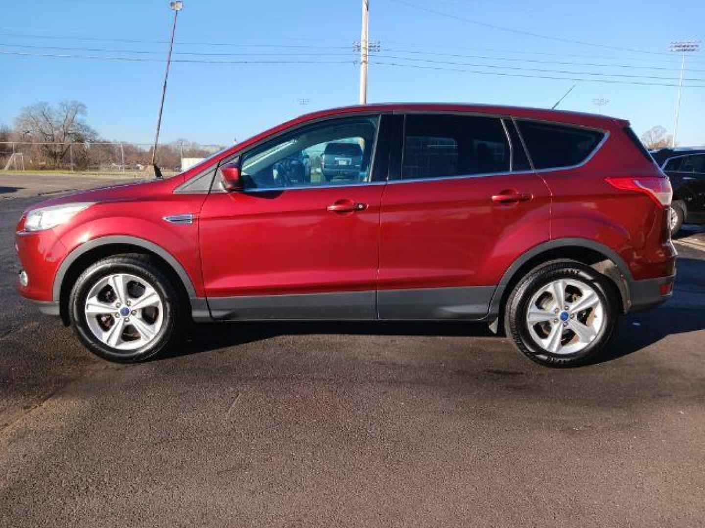 2014 Ruby Red Tinted CC Ford Escape SE FWD (1FMCU0G93EU) with an 2.0L L4 DOHC 16V engine, 6-Speed Automatic transmission, located at 401 Woodman Dr, Riverside, OH, 45431, (937) 908-9800, 39.763779, -84.122063 - Photo#3