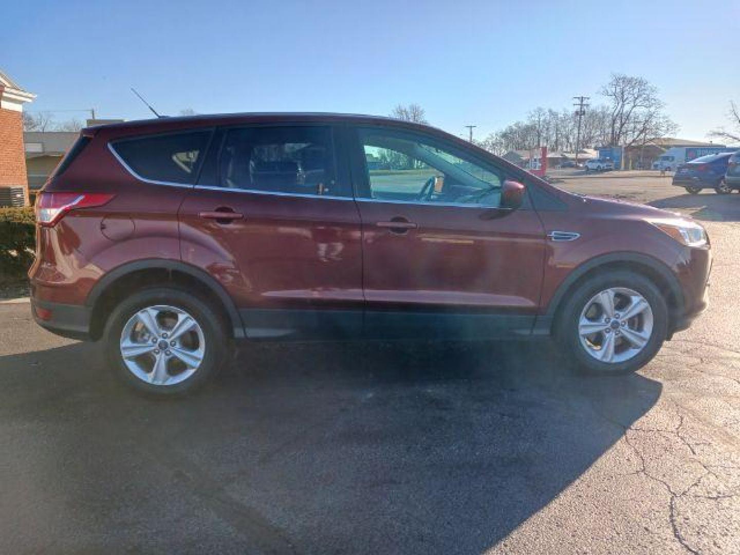 2014 Ruby Red Tinted CC Ford Escape SE FWD (1FMCU0G93EU) with an 2.0L L4 DOHC 16V engine, 6-Speed Automatic transmission, located at 401 Woodman Dr, Riverside, OH, 45431, (937) 908-9800, 39.763779, -84.122063 - Photo#4