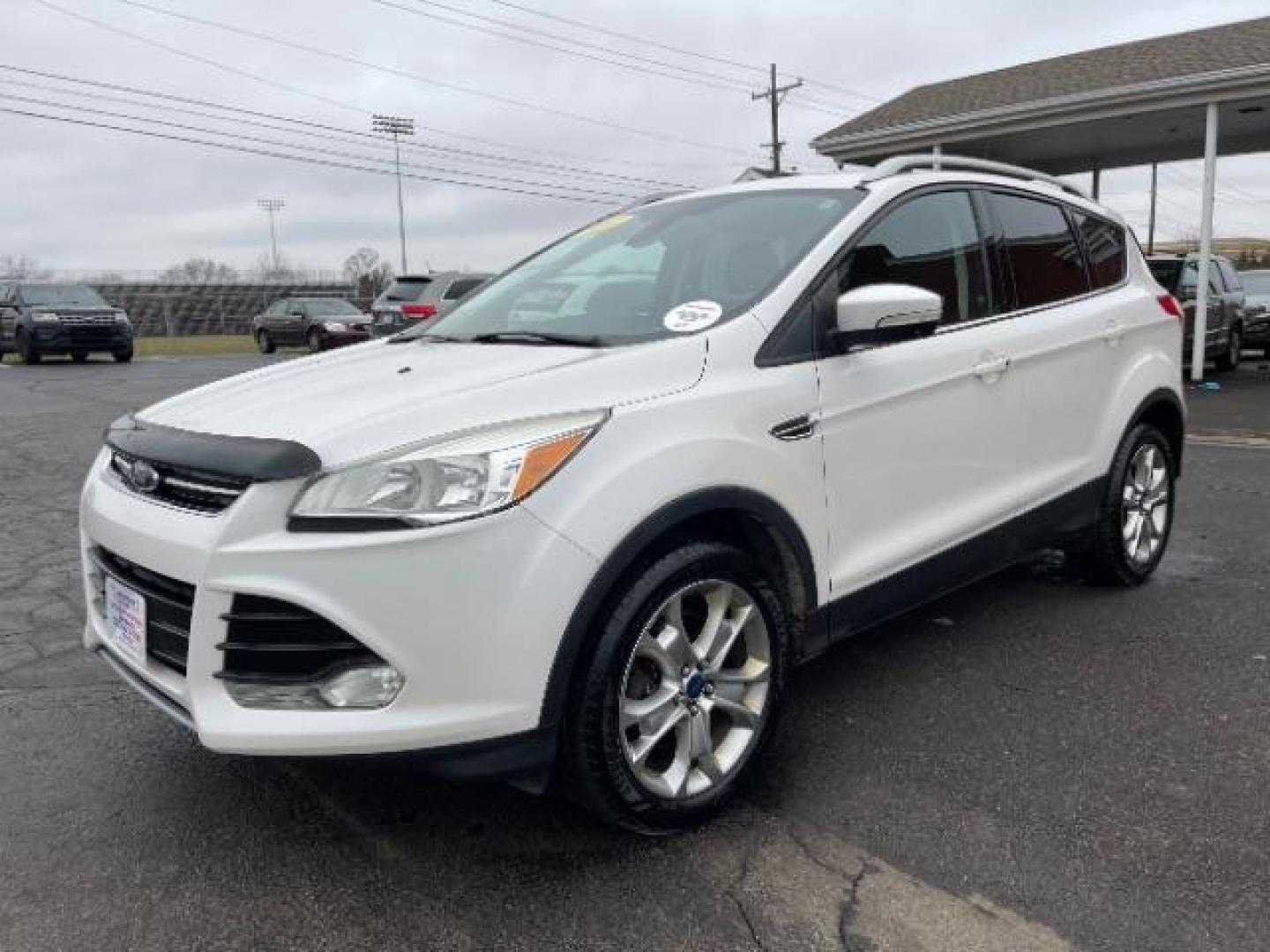 2014 White Platinum Tricoat Ford Escape Titanium 4WD (1FMCU9J95EU) with an 2.0L L4 DOHC 16V engine, 6-Speed Automatic transmission, located at 1951 S Dayton Lakeview Rd., New Carlisle, OH, 45344, (937) 908-9800, 39.890999, -84.050255 - Photo#1