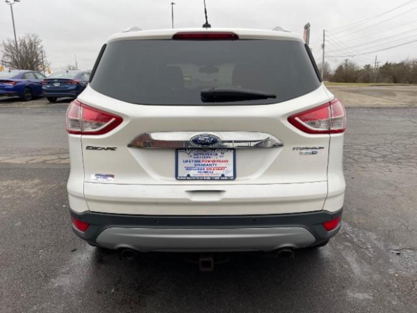 2014 White Platinum Tricoat Ford Escape Titanium 4WD (1FMCU9J95EU) with an 2.0L L4 DOHC 16V engine, 6-Speed Automatic transmission, located at 1951 S Dayton Lakeview Rd., New Carlisle, OH, 45344, (937) 908-9800, 39.890999, -84.050255 - Photo#2