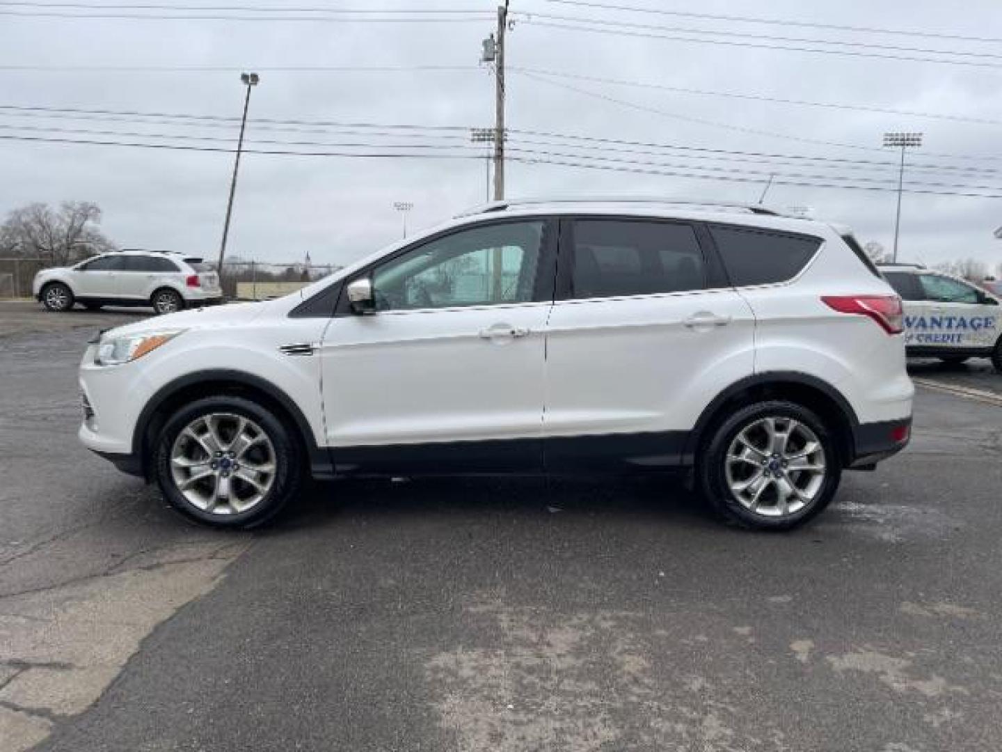 2014 White Platinum Tricoat Ford Escape Titanium 4WD (1FMCU9J95EU) with an 2.0L L4 DOHC 16V engine, 6-Speed Automatic transmission, located at 1951 S Dayton Lakeview Rd., New Carlisle, OH, 45344, (937) 908-9800, 39.890999, -84.050255 - Photo#4