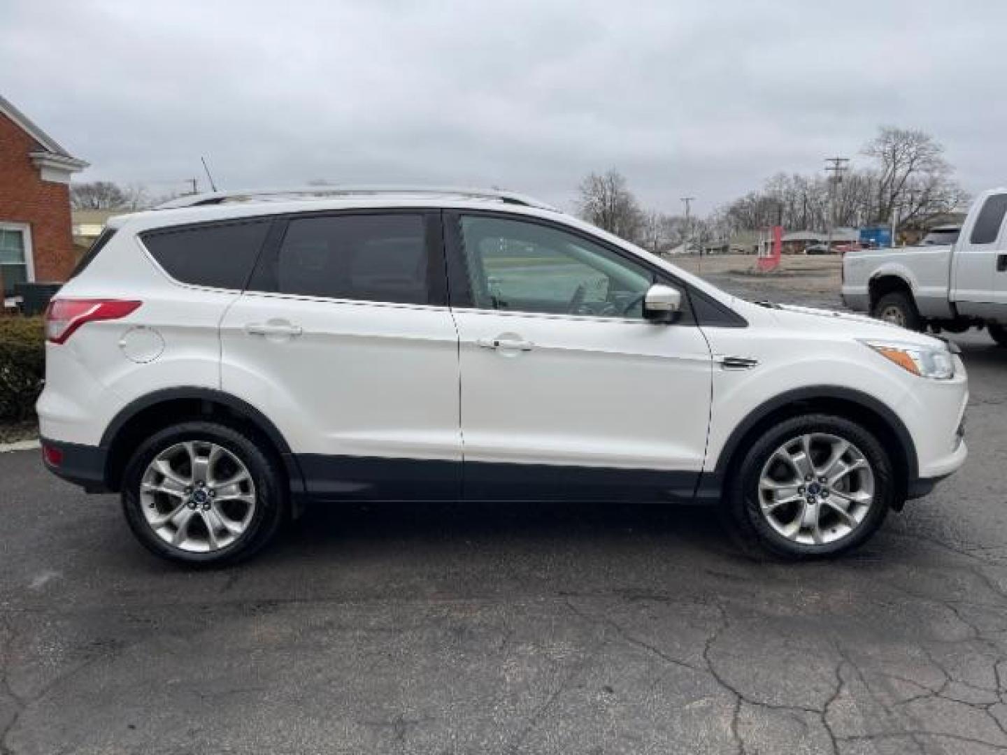 2014 White Platinum Tricoat Ford Escape Titanium 4WD (1FMCU9J95EU) with an 2.0L L4 DOHC 16V engine, 6-Speed Automatic transmission, located at 1951 S Dayton Lakeview Rd., New Carlisle, OH, 45344, (937) 908-9800, 39.890999, -84.050255 - Photo#5