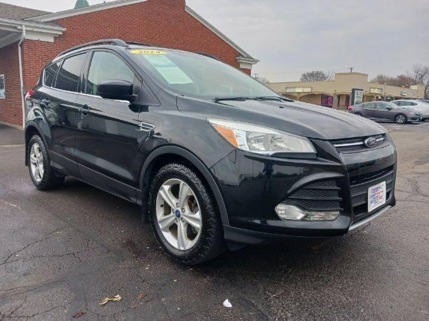 2014 Tuxedo Black Ford Escape SE 4WD (1FMCU9G99EU) with an 2.0L L4 DOHC 16V engine, 6-Speed Automatic transmission, located at 880 E. National Road, Vandalia, OH, 45377, (937) 908-9800, 39.892189, -84.181015 - Photo#0