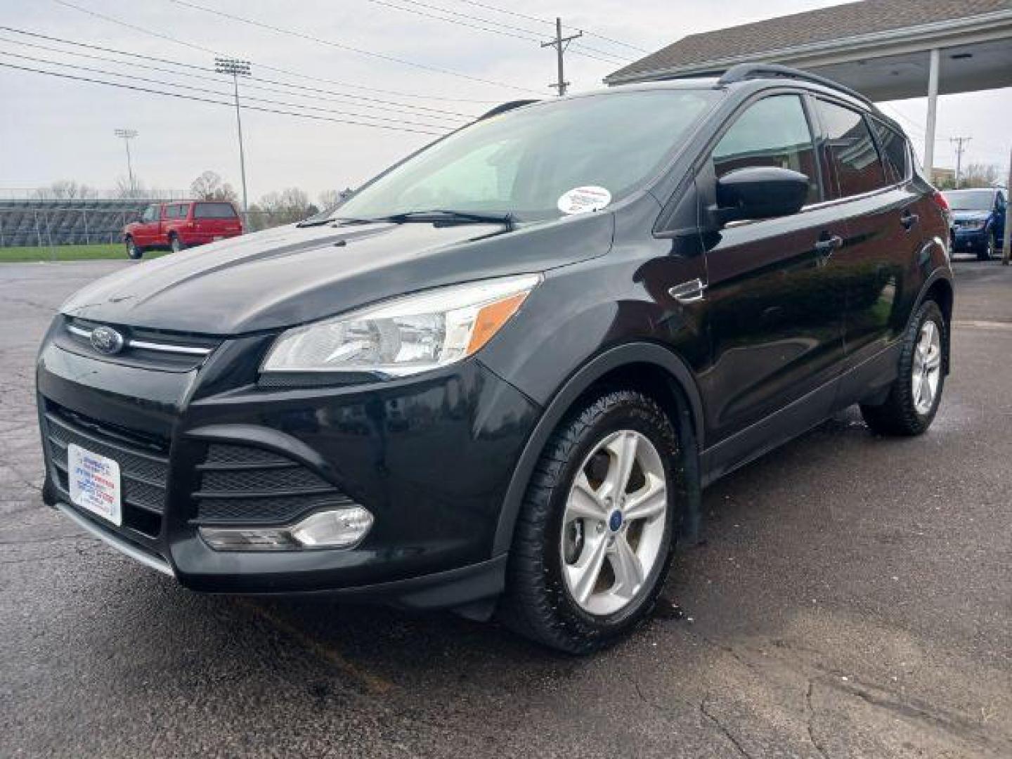 2014 Tuxedo Black Ford Escape SE 4WD (1FMCU9G99EU) with an 2.0L L4 DOHC 16V engine, 6-Speed Automatic transmission, located at 880 E. National Road, Vandalia, OH, 45377, (937) 908-9800, 39.892189, -84.181015 - Photo#2