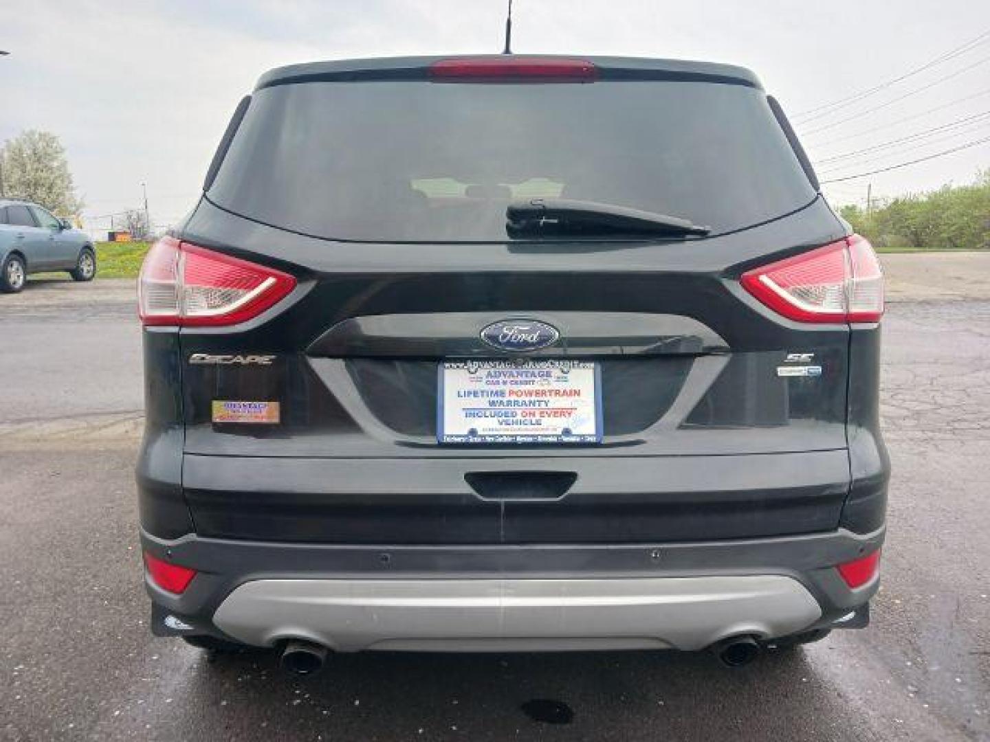 2014 Tuxedo Black Ford Escape SE 4WD (1FMCU9G99EU) with an 2.0L L4 DOHC 16V engine, 6-Speed Automatic transmission, located at 880 E. National Road, Vandalia, OH, 45377, (937) 908-9800, 39.892189, -84.181015 - Photo#5