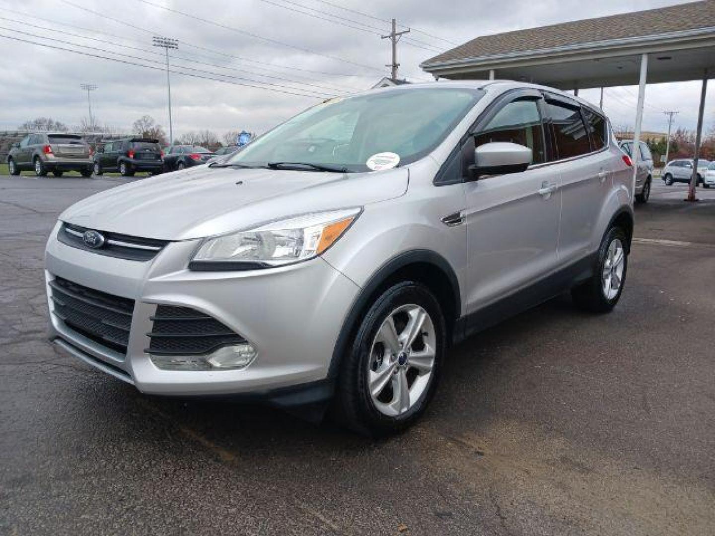 2014 Ingot Silver Metallic Ford Escape SE 4WD (1FMCU9G92EU) with an 2.0L L4 DOHC 16V engine, 6-Speed Automatic transmission, located at 1099 N County Rd 25A, OH, 45373, (937) 908-9800, 40.057079, -84.212883 - Photo#2