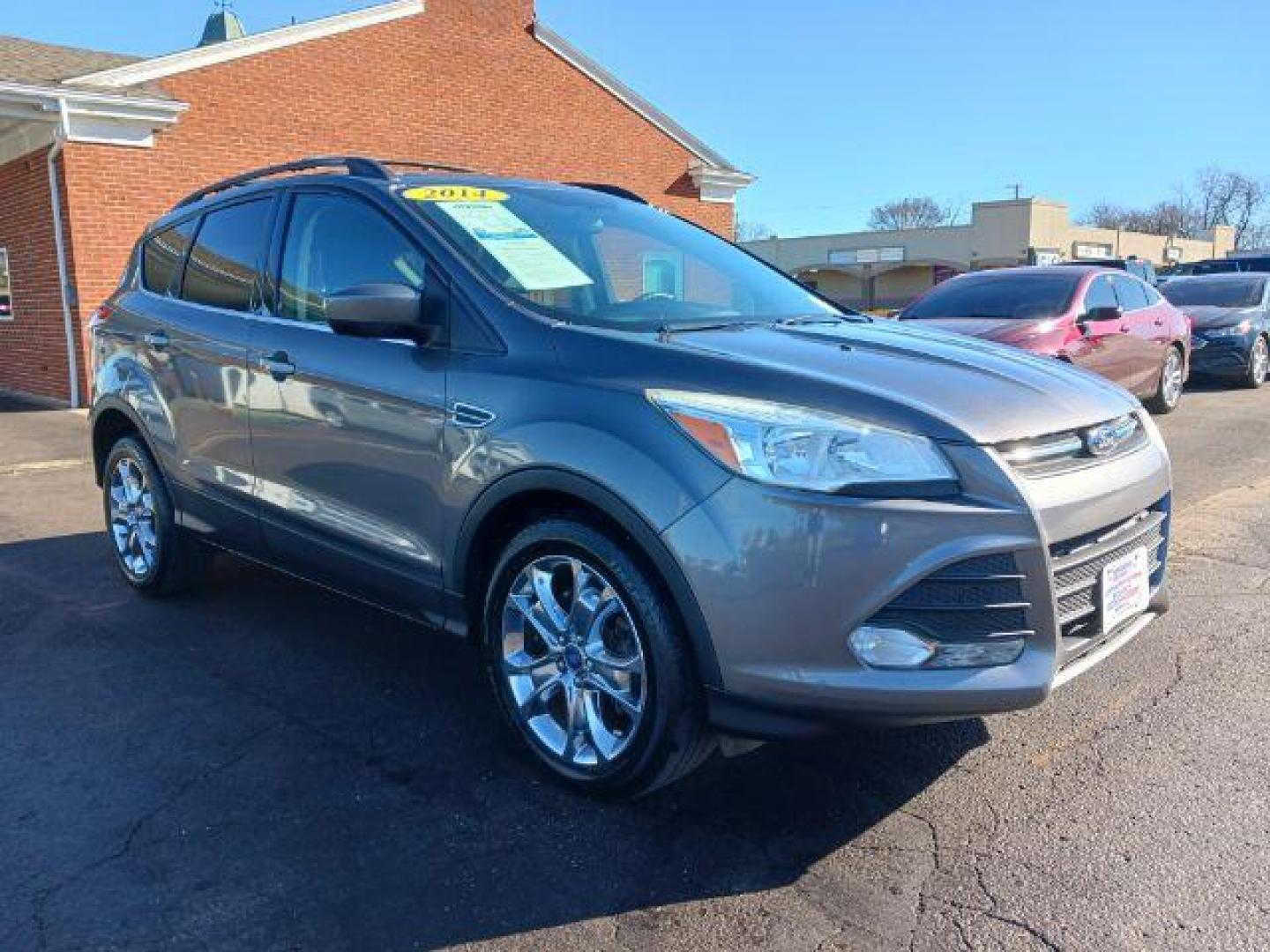 2014 Sterling Gray Metallic Ford Escape SE 4WD (1FMCU9G98EU) with an 2.0L L4 DOHC 16V engine, 6-Speed Automatic transmission, located at 401 Woodman Dr, Riverside, OH, 45431, (937) 908-9800, 39.763779, -84.122063 - Photo#0