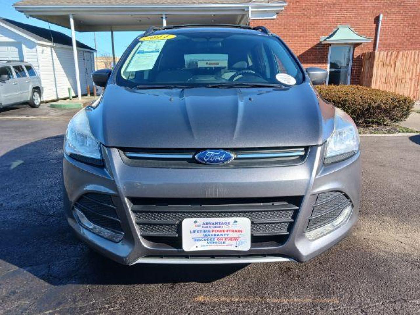 2014 Sterling Gray Metallic Ford Escape SE 4WD (1FMCU9G98EU) with an 2.0L L4 DOHC 16V engine, 6-Speed Automatic transmission, located at 401 Woodman Dr, Riverside, OH, 45431, (937) 908-9800, 39.763779, -84.122063 - Photo#1