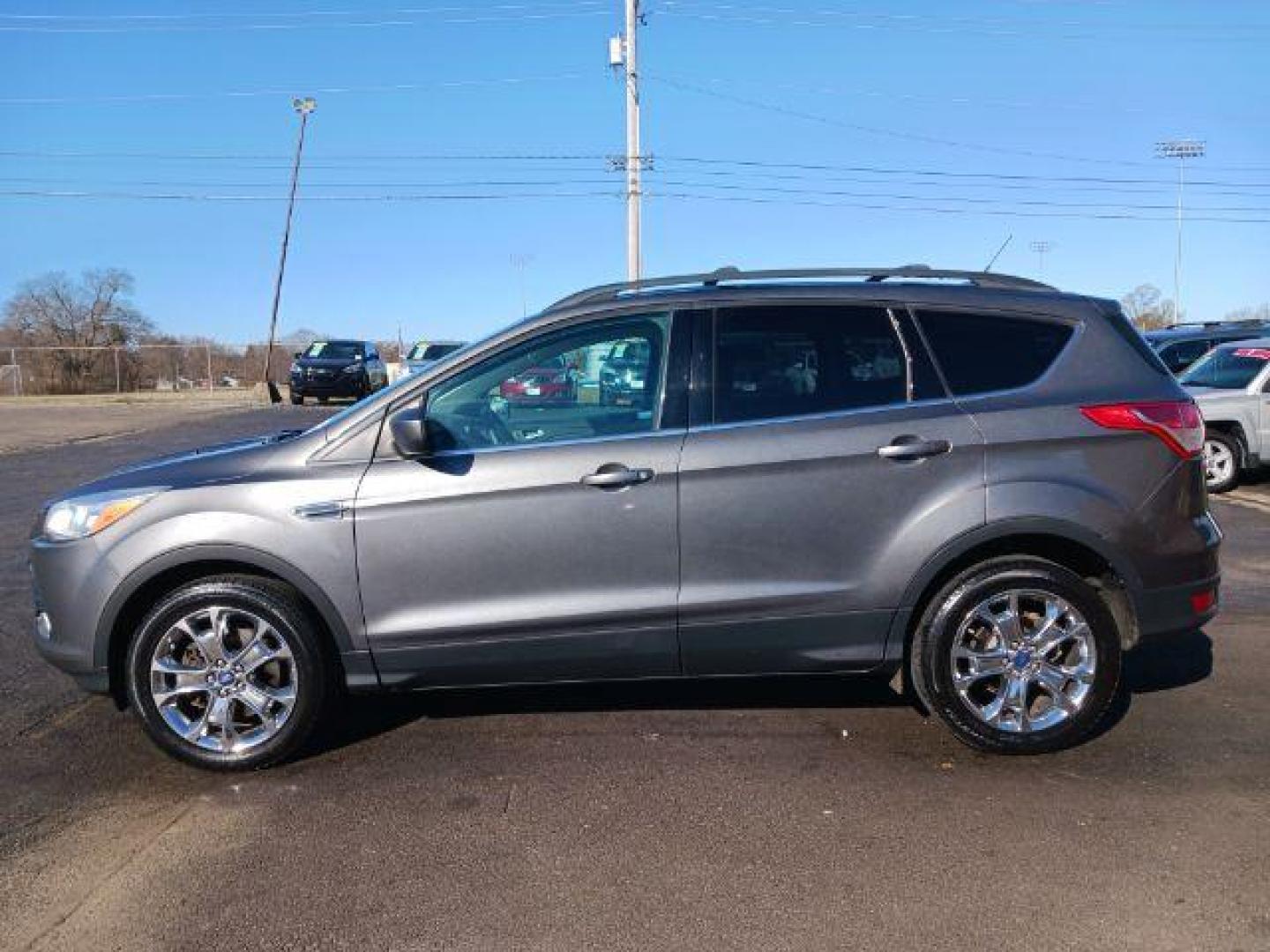 2014 Sterling Gray Metallic Ford Escape SE 4WD (1FMCU9G98EU) with an 2.0L L4 DOHC 16V engine, 6-Speed Automatic transmission, located at 401 Woodman Dr, Riverside, OH, 45431, (937) 908-9800, 39.763779, -84.122063 - Photo#3