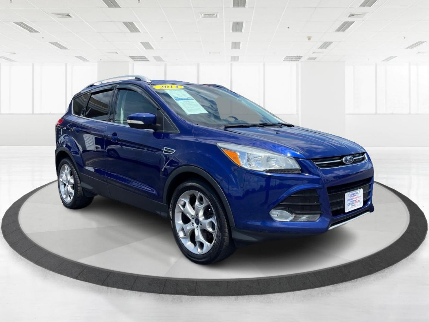 2014 Deep Impact Blue Ford Escape Titanium 4WD (1FMCU9J91EU) with an 2.0L L4 DOHC 16V engine, 6-Speed Automatic transmission, located at 401 Woodman Dr, Riverside, OH, 45431, (937) 908-9800, 39.763779, -84.122063 - Photo#0