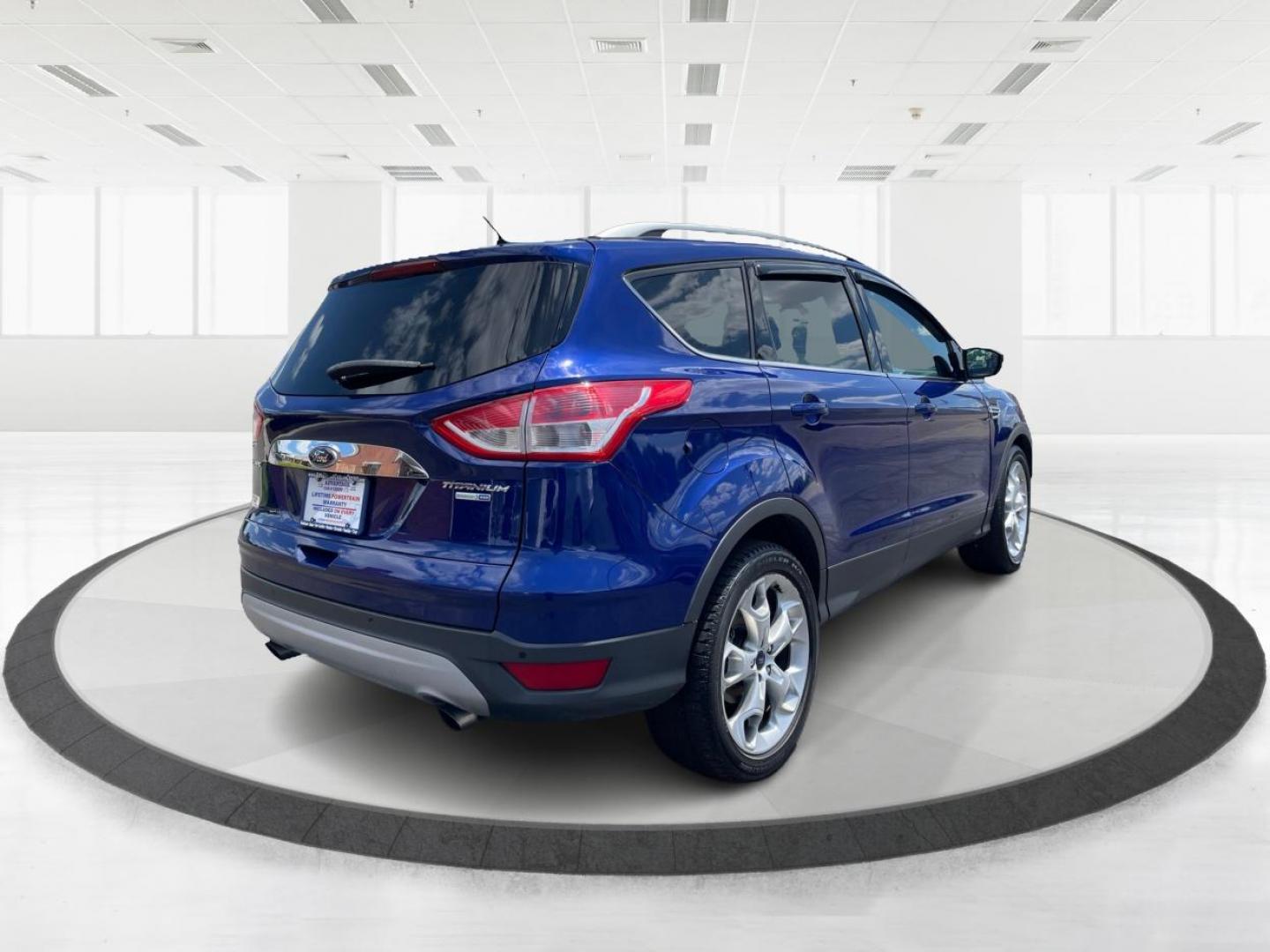 2014 Deep Impact Blue Ford Escape Titanium 4WD (1FMCU9J91EU) with an 2.0L L4 DOHC 16V engine, 6-Speed Automatic transmission, located at 401 Woodman Dr, Riverside, OH, 45431, (937) 908-9800, 39.763779, -84.122063 - Photo#2