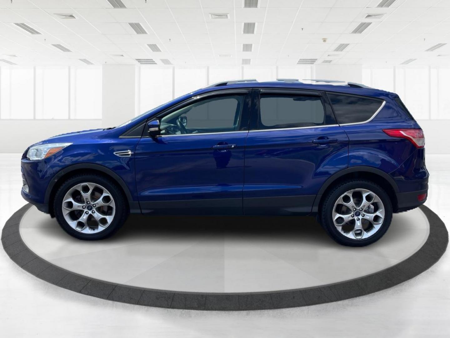 2014 Deep Impact Blue Ford Escape Titanium 4WD (1FMCU9J91EU) with an 2.0L L4 DOHC 16V engine, 6-Speed Automatic transmission, located at 401 Woodman Dr, Riverside, OH, 45431, (937) 908-9800, 39.763779, -84.122063 - Photo#5