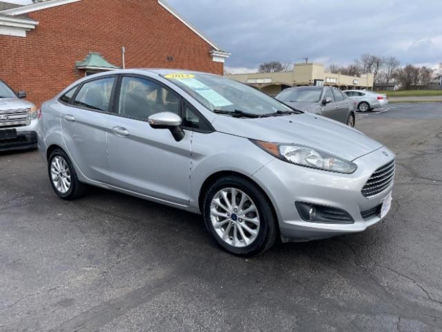 2014 Ingot Silver Metallic Ford Fiesta SE Sedan (3FADP4BJ6EM) with an 1.6L L4 DOHC 16V engine, located at 401 Woodman Dr, Riverside, OH, 45431, (937) 908-9800, 39.763779, -84.122063 - Photo#0