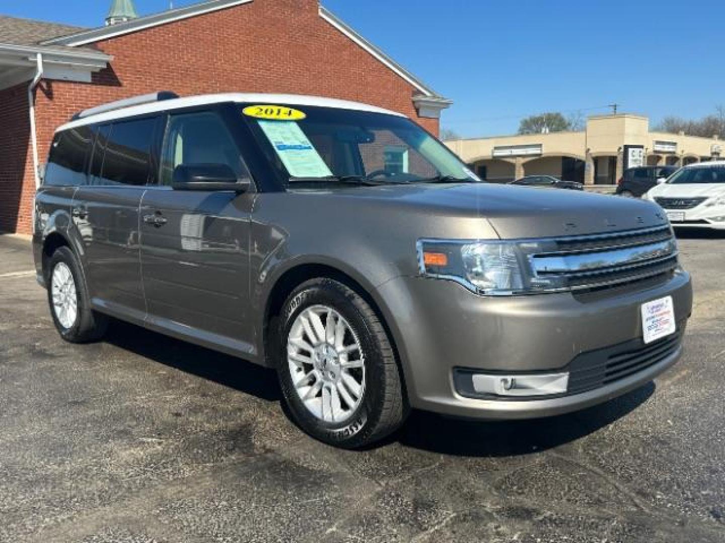 2014 Mineral Gray Metallic Ford Flex SEL FWD (2FMGK5C84EB) with an 3.5L V6 DOHC 24V engine, 6-Speed Automatic Overdrive transmission, located at 1099 N County Rd 25A, OH, 45373, (937) 908-9800, 40.057079, -84.212883 - Photo#0