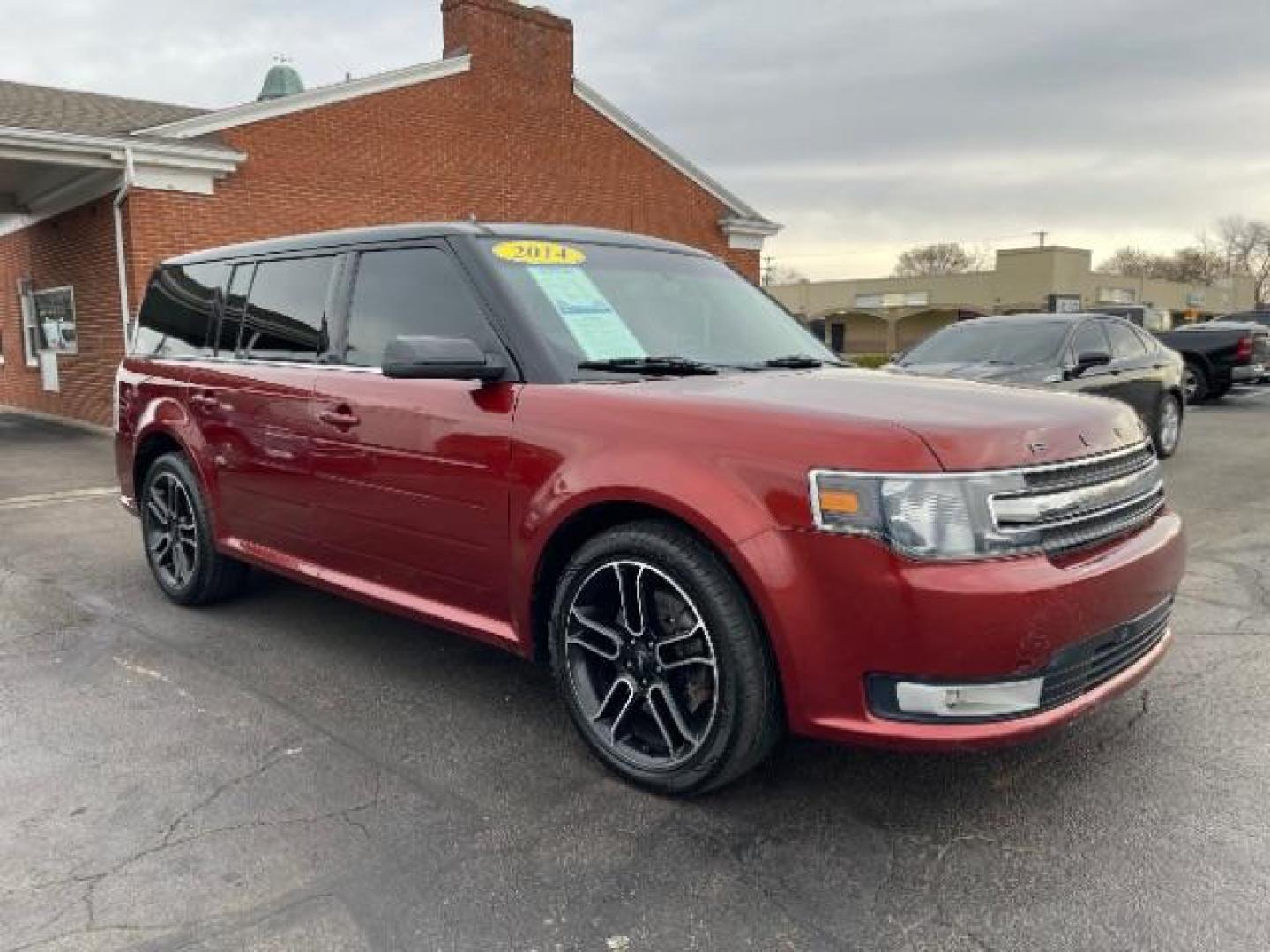 2014 Orange Ford Flex SEL FWD (2FMGK5C89EB) with an 3.5L V6 DOHC 24V engine, 6-Speed Automatic Overdrive transmission, located at 401 Woodman Dr, Riverside, OH, 45431, (937) 908-9800, 39.763779, -84.122063 - Photo#0