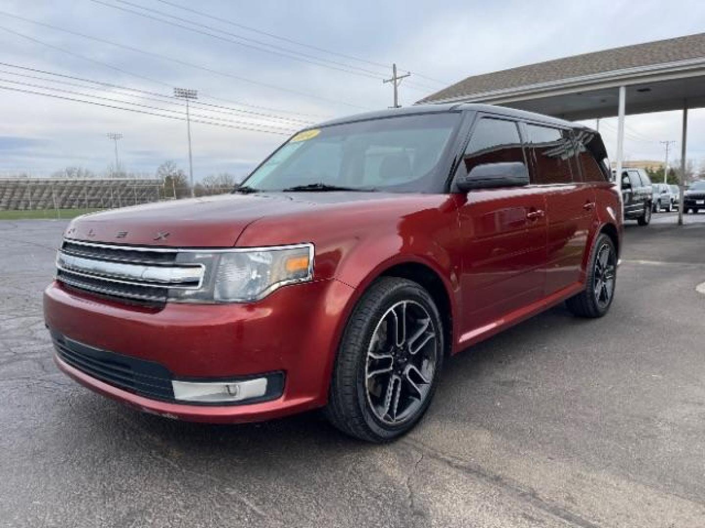 2014 Orange Ford Flex SEL FWD (2FMGK5C89EB) with an 3.5L V6 DOHC 24V engine, 6-Speed Automatic Overdrive transmission, located at 401 Woodman Dr, Riverside, OH, 45431, (937) 908-9800, 39.763779, -84.122063 - Photo#1