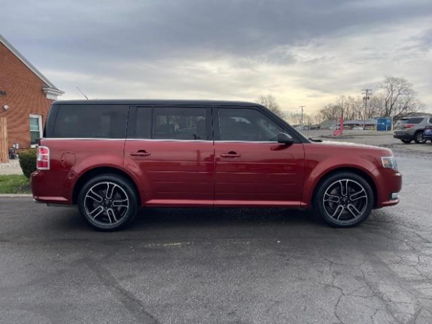 2014 Orange Ford Flex SEL FWD (2FMGK5C89EB) with an 3.5L V6 DOHC 24V engine, 6-Speed Automatic Overdrive transmission, located at 401 Woodman Dr, Riverside, OH, 45431, (937) 908-9800, 39.763779, -84.122063 - Photo#2