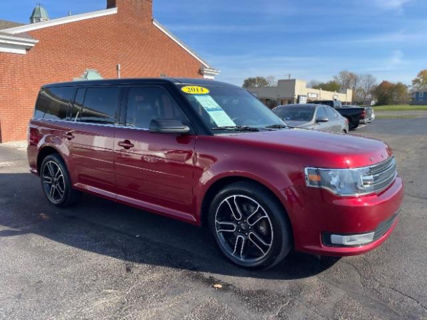 2014 Ruby Red Met Tinted CC Ford Flex SEL AWD (2FMHK6C86EB) with an 3.5L V6 DOHC 24V engine, 6-Speed Automatic Overdrive transmission, located at 880 E. National Road, Vandalia, OH, 45377, (937) 908-9800, 39.892189, -84.181015 - Photo#0