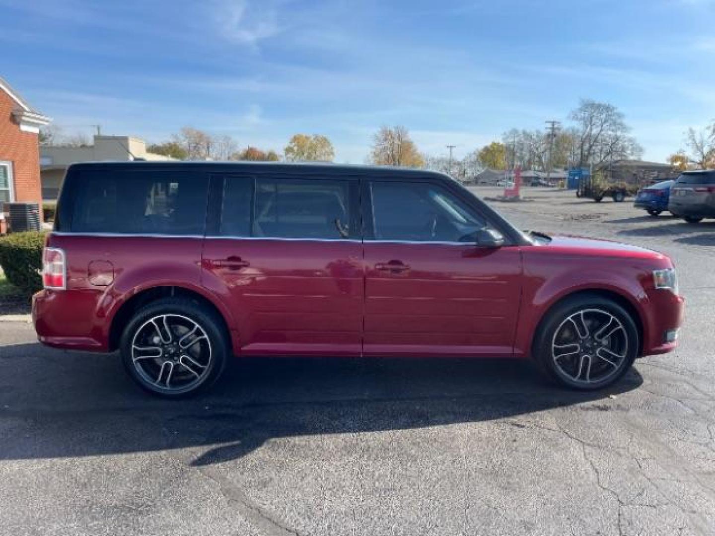 2014 Ruby Red Met Tinted CC Ford Flex SEL AWD (2FMHK6C86EB) with an 3.5L V6 DOHC 24V engine, 6-Speed Automatic Overdrive transmission, located at 880 E. National Road, Vandalia, OH, 45377, (937) 908-9800, 39.892189, -84.181015 - Photo#5