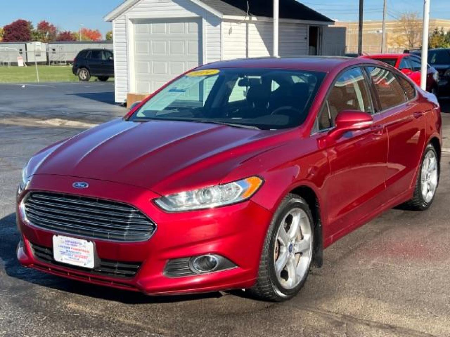 2014 Ruby Red Met Tinted CC Ford Fusion SE (3FA6P0H77ER) with an 2.5L L4 DOHC 16V engine, located at 1951 S Dayton Lakeview Rd., New Carlisle, OH, 45344, (937) 908-9800, 39.890999, -84.050255 - Photo#2