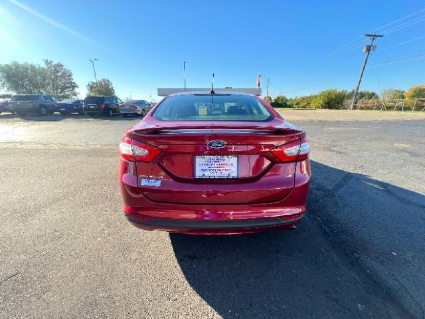 2014 Ruby Red Met Tinted CC Ford Fusion SE (3FA6P0H77ER) with an 2.5L L4 DOHC 16V engine, located at 1951 S Dayton Lakeview Rd., New Carlisle, OH, 45344, (937) 908-9800, 39.890999, -84.050255 - Photo#4