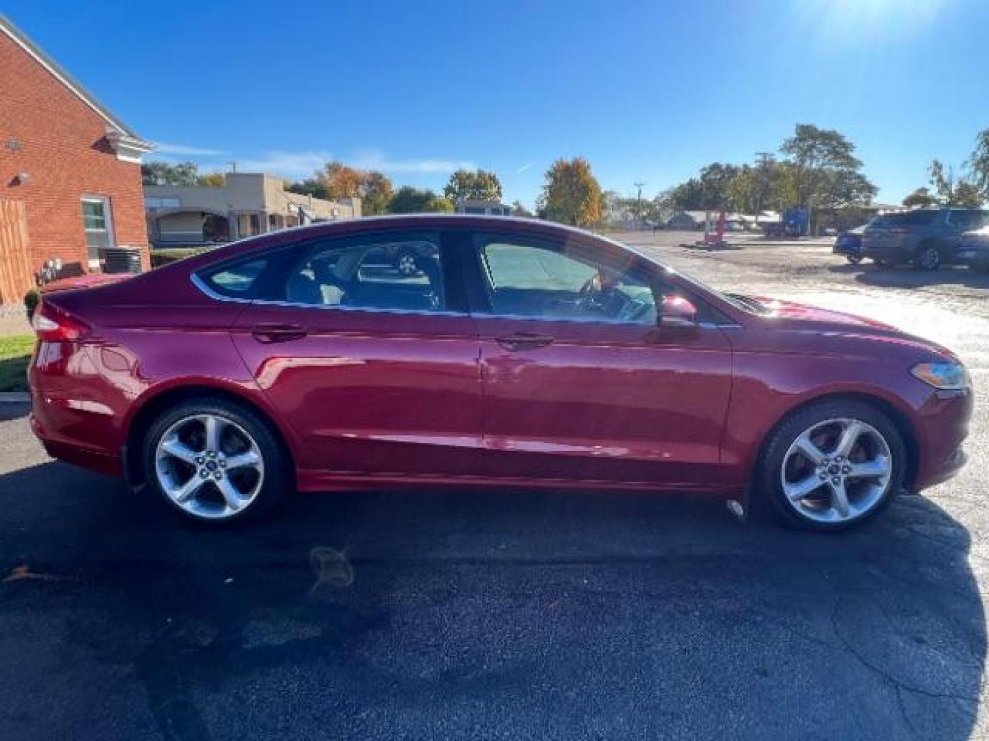 2014 Ruby Red Met Tinted CC Ford Fusion SE (3FA6P0H77ER) with an 2.5L L4 DOHC 16V engine, located at 1951 S Dayton Lakeview Rd., New Carlisle, OH, 45344, (937) 908-9800, 39.890999, -84.050255 - Photo#5