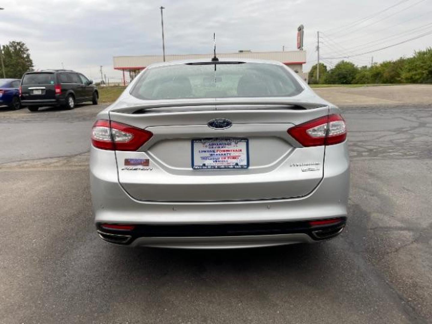 2014 Sterling Gray Ford Fusion Titanium (3FA6P0K90ER) with an 2.0L L4 DOHC 16V engine, located at 1230 East Main St, Xenia, OH, 45385, (937) 908-9800, 39.687321, -83.910294 - Photo#4