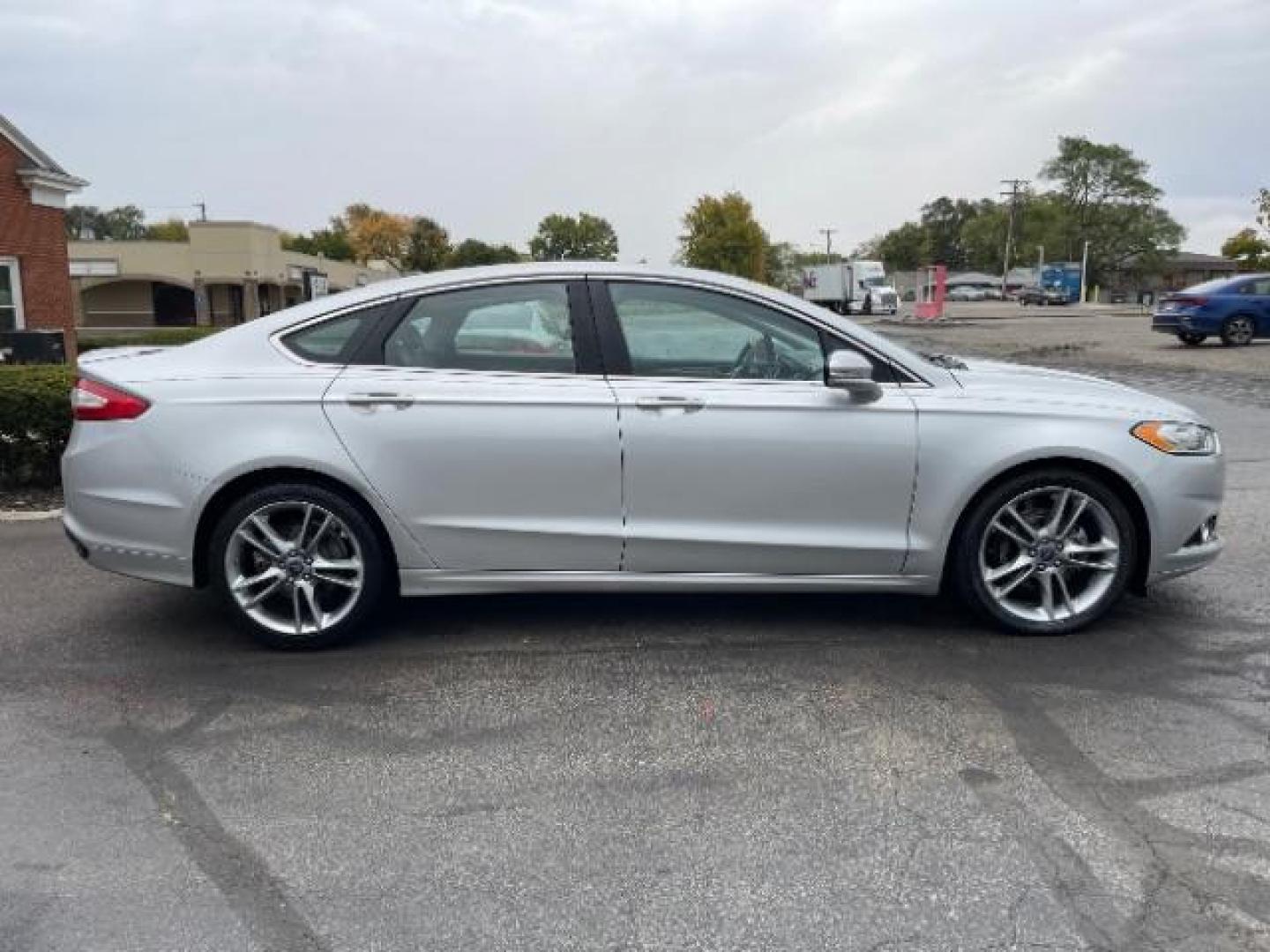 2014 Sterling Gray Ford Fusion Titanium (3FA6P0K90ER) with an 2.0L L4 DOHC 16V engine, located at 1230 East Main St, Xenia, OH, 45385, (937) 908-9800, 39.687321, -83.910294 - Photo#5