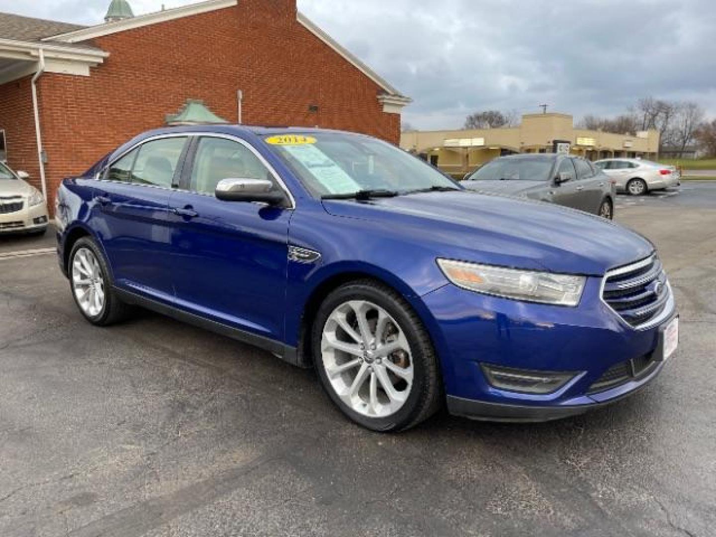 2014 Deep Impact Blue Metallic Ford Taurus Limited AWD (1FAHP2J86EG) with an 3.5L V6 DOHC 24V engine, 6-Speed Automatic transmission, located at 1230 East Main St, Xenia, OH, 45385, (937) 908-9800, 39.687321, -83.910294 - Photo#0