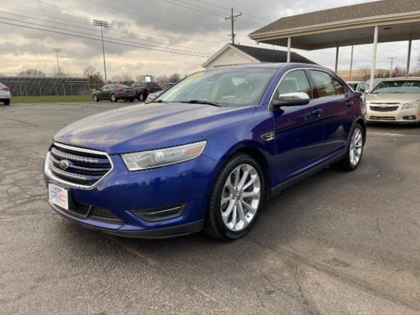 2014 Deep Impact Blue Metallic Ford Taurus Limited AWD (1FAHP2J86EG) with an 3.5L V6 DOHC 24V engine, 6-Speed Automatic transmission, located at 1230 East Main St, Xenia, OH, 45385, (937) 908-9800, 39.687321, -83.910294 - Photo#1