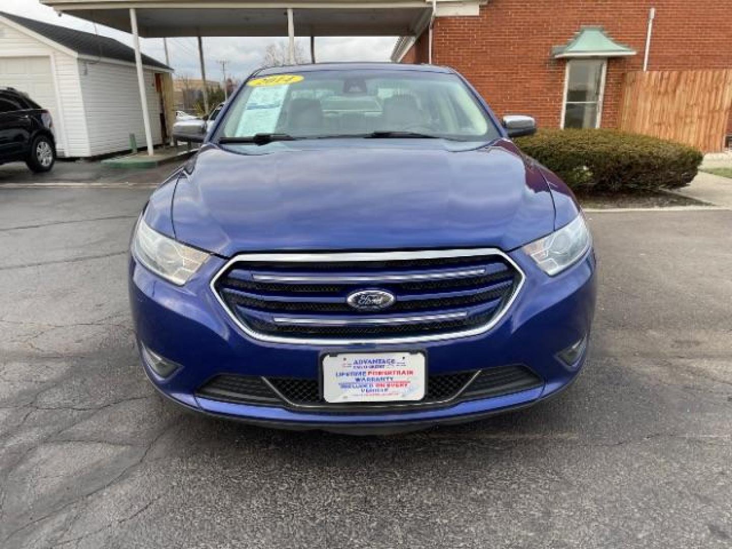 2014 Deep Impact Blue Metallic Ford Taurus Limited AWD (1FAHP2J86EG) with an 3.5L V6 DOHC 24V engine, 6-Speed Automatic transmission, located at 1230 East Main St, Xenia, OH, 45385, (937) 908-9800, 39.687321, -83.910294 - Photo#2