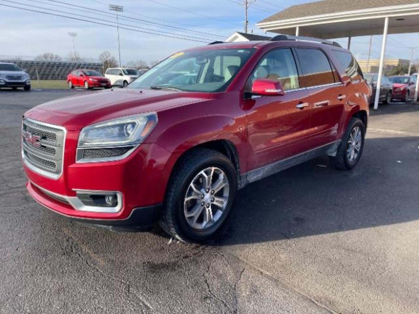 2014 Crystal Red Tintcoat GMC Acadia SLT-1 FWD (1GKKRRKDXEJ) with an 3.6L V6 DOHC 24V engine, 6-Speed Automatic transmission, located at 1099 N County Rd 25A, OH, 45373, (937) 908-9800, 40.057079, -84.212883 - Photo#1