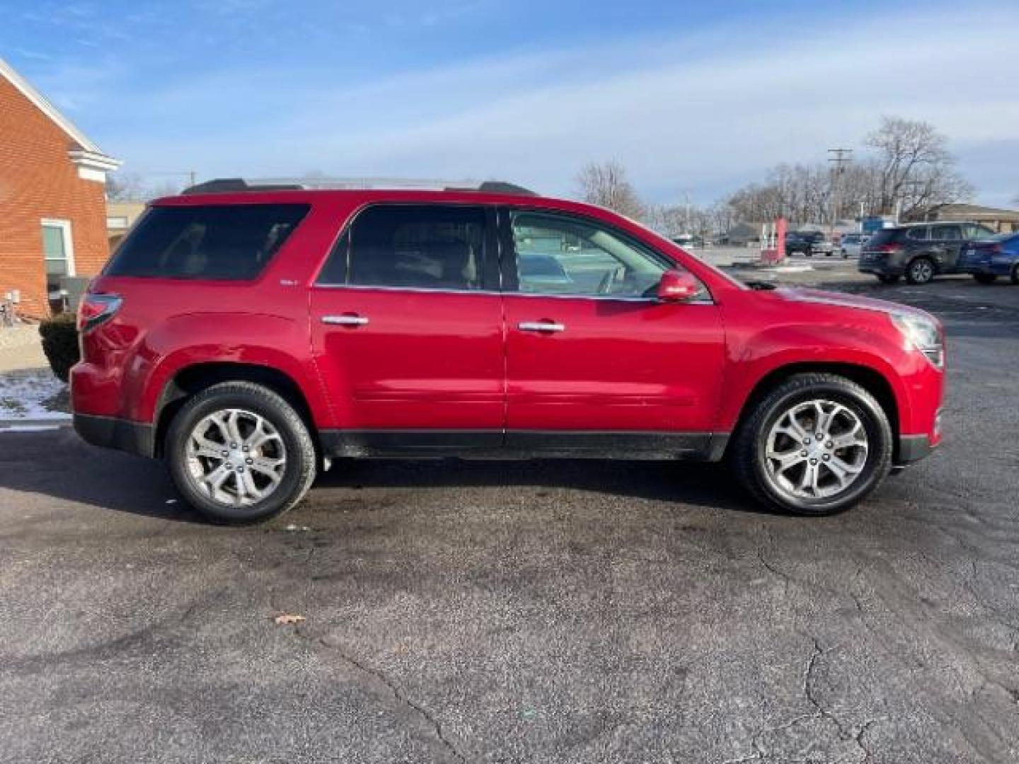 2014 Crystal Red Tintcoat GMC Acadia SLT-1 FWD (1GKKRRKDXEJ) with an 3.6L V6 DOHC 24V engine, 6-Speed Automatic transmission, located at 1099 N County Rd 25A, OH, 45373, (937) 908-9800, 40.057079, -84.212883 - Photo#2