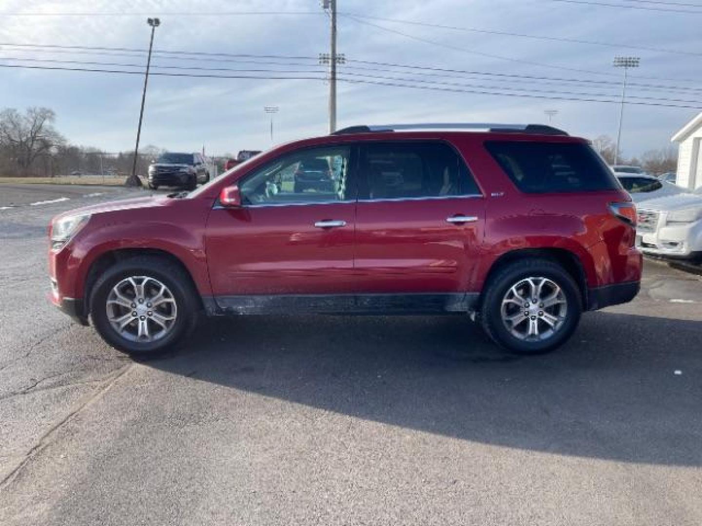 2014 Crystal Red Tintcoat GMC Acadia SLT-1 FWD (1GKKRRKDXEJ) with an 3.6L V6 DOHC 24V engine, 6-Speed Automatic transmission, located at 1099 N County Rd 25A, OH, 45373, (937) 908-9800, 40.057079, -84.212883 - Photo#3