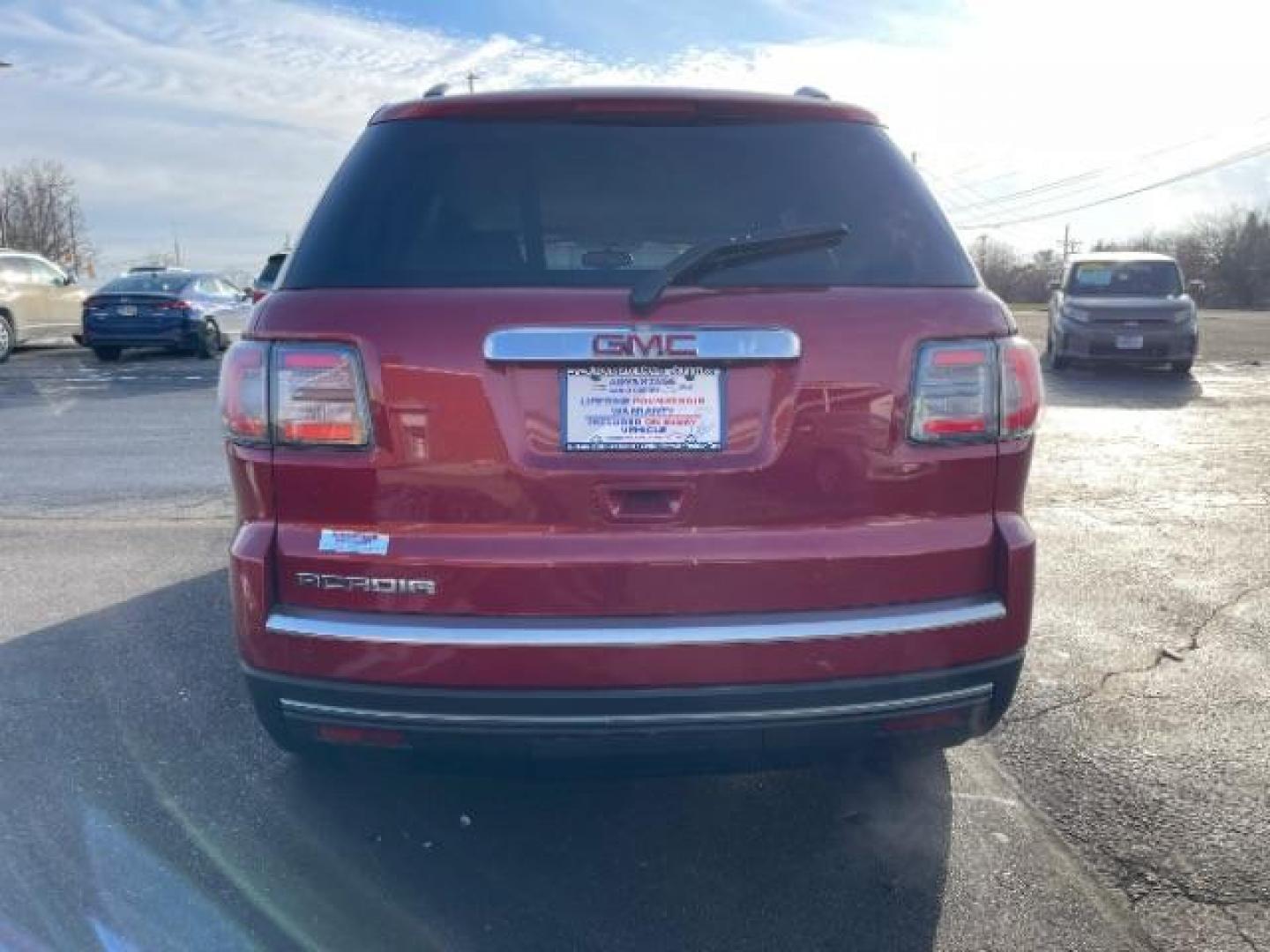 2014 Crystal Red Tintcoat GMC Acadia SLT-1 FWD (1GKKRRKDXEJ) with an 3.6L V6 DOHC 24V engine, 6-Speed Automatic transmission, located at 1099 N County Rd 25A, OH, 45373, (937) 908-9800, 40.057079, -84.212883 - Photo#5