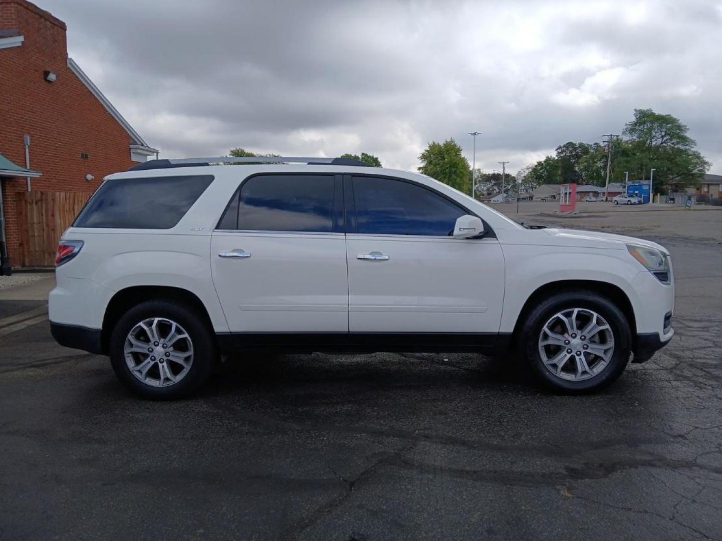 2014 Summit White GMC Acadia SLT-1 AWD (1GKKVRKD8EJ) with an 3.6L V6 DOHC 24V engine, 6-Speed Automatic transmission, located at 1099 N County Rd 25A, OH, 45373, (937) 908-9800, 40.057079, -84.212883 - Photo#0