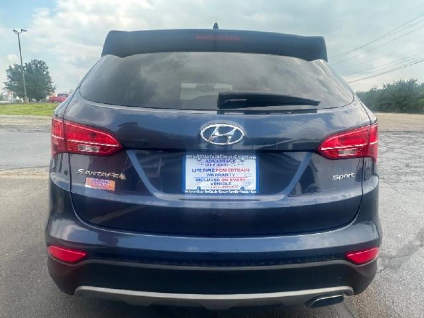 2014 Marlin Blue Hyundai Santa Fe Sport 2.4 FWD (5XYZT3LB3EG) with an 2.4L L4 DOHC 16V engine, 6-Speed Automatic transmission, located at 1230 East Main St, Xenia, OH, 45385, (937) 908-9800, 39.687321, -83.910294 - Photo#4