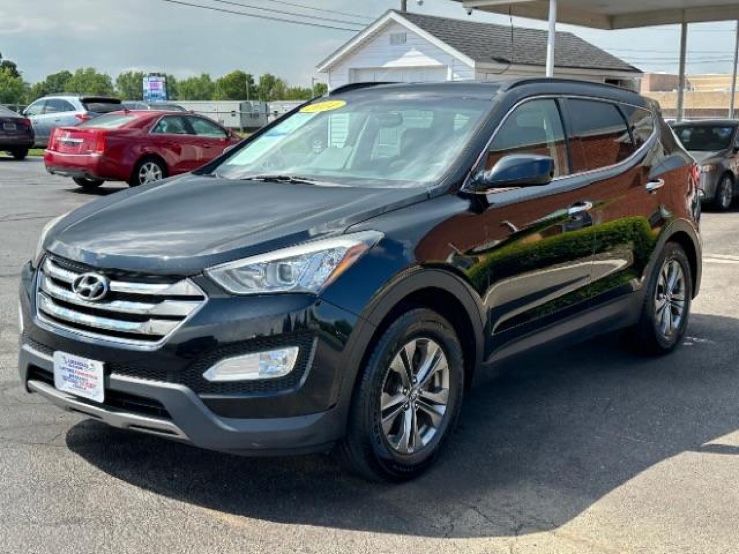 2014 Twilight Black Hyundai Santa Fe Sport 2.4 FWD (5XYZU3LB4EG) with an 2.4L L4 DOHC 16V engine, 6-Speed Automatic transmission, located at 401 Woodman Dr, Riverside, OH, 45431, (937) 908-9800, 39.763779, -84.122063 - Photo#2