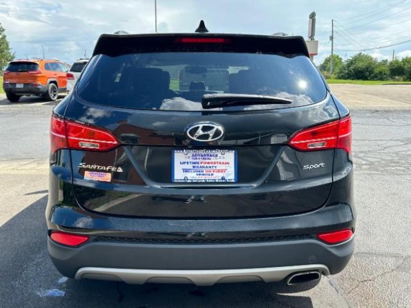 2014 Twilight Black Hyundai Santa Fe Sport 2.4 FWD (5XYZU3LB4EG) with an 2.4L L4 DOHC 16V engine, 6-Speed Automatic transmission, located at 401 Woodman Dr, Riverside, OH, 45431, (937) 908-9800, 39.763779, -84.122063 - Photo#4