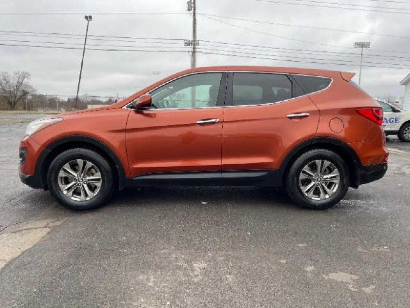 2014 Canyon Copper Hyundai Santa Fe Sport 2.4 FWD (5XYZT3LB1EG) with an 2.4L L4 DOHC 16V engine, 6-Speed Automatic transmission, located at 1951 S Dayton Lakeview Rd., New Carlisle, OH, 45344, (937) 908-9800, 39.890999, -84.050255 - Photo#2