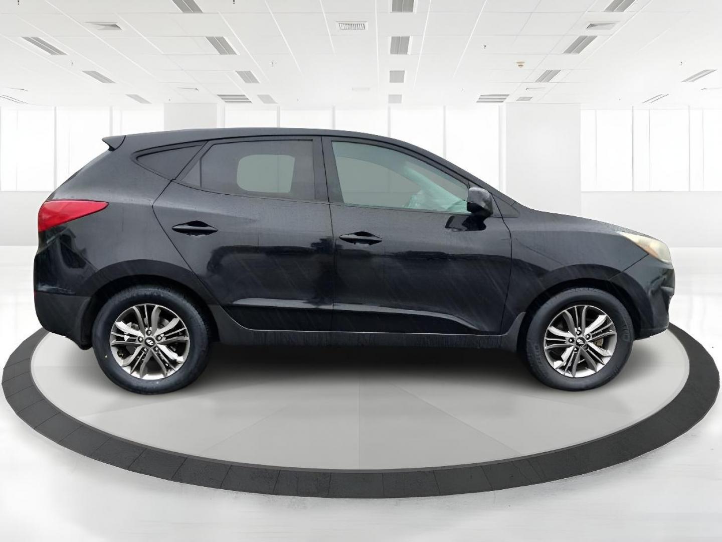 2014 Black Hyundai Tucson GL Auto AWD (KM8JTCAF0EU) with an 2.0L L4 DOHC 16V engine, 6-Speed Automatic transmission, located at 880 E. National Road, Vandalia, OH, 45377, (937) 908-9800, 39.892189, -84.181015 - Photo#1