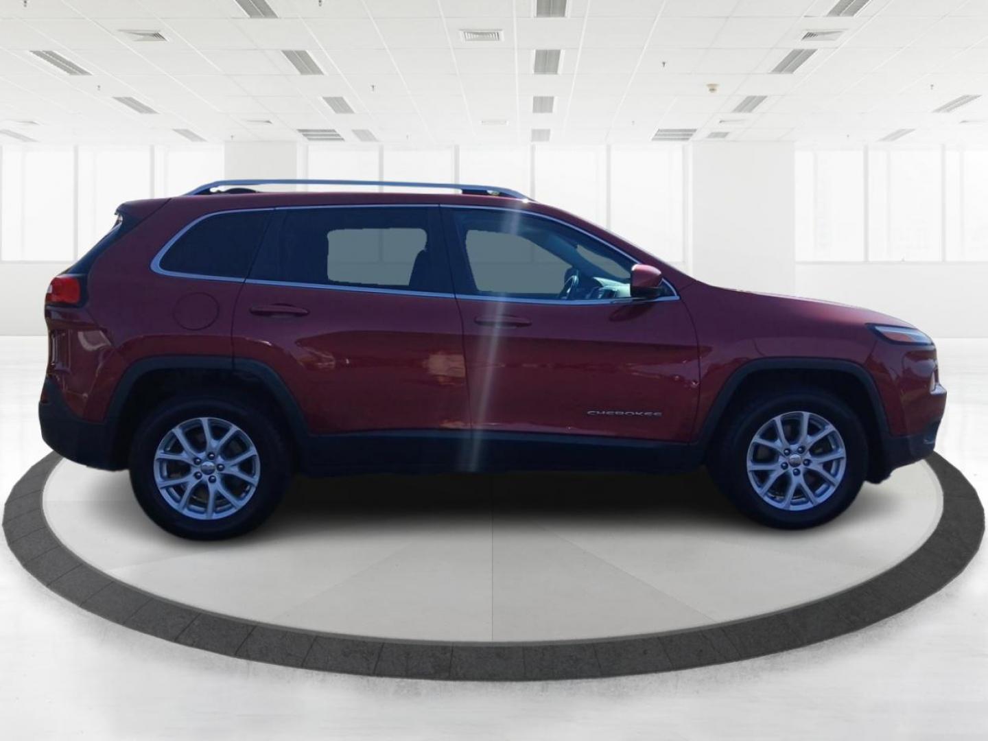 2014 Dp Cherry Red Crystal PC Jeep Cherokee (1C4PJMCS0EW) with an 3.2L V6 DOHC 24V engine, 9-Speed Automatic transmission, located at 1099 N County Rd 25A, OH, 45373, (937) 908-9800, 40.057079, -84.212883 - Photo#1