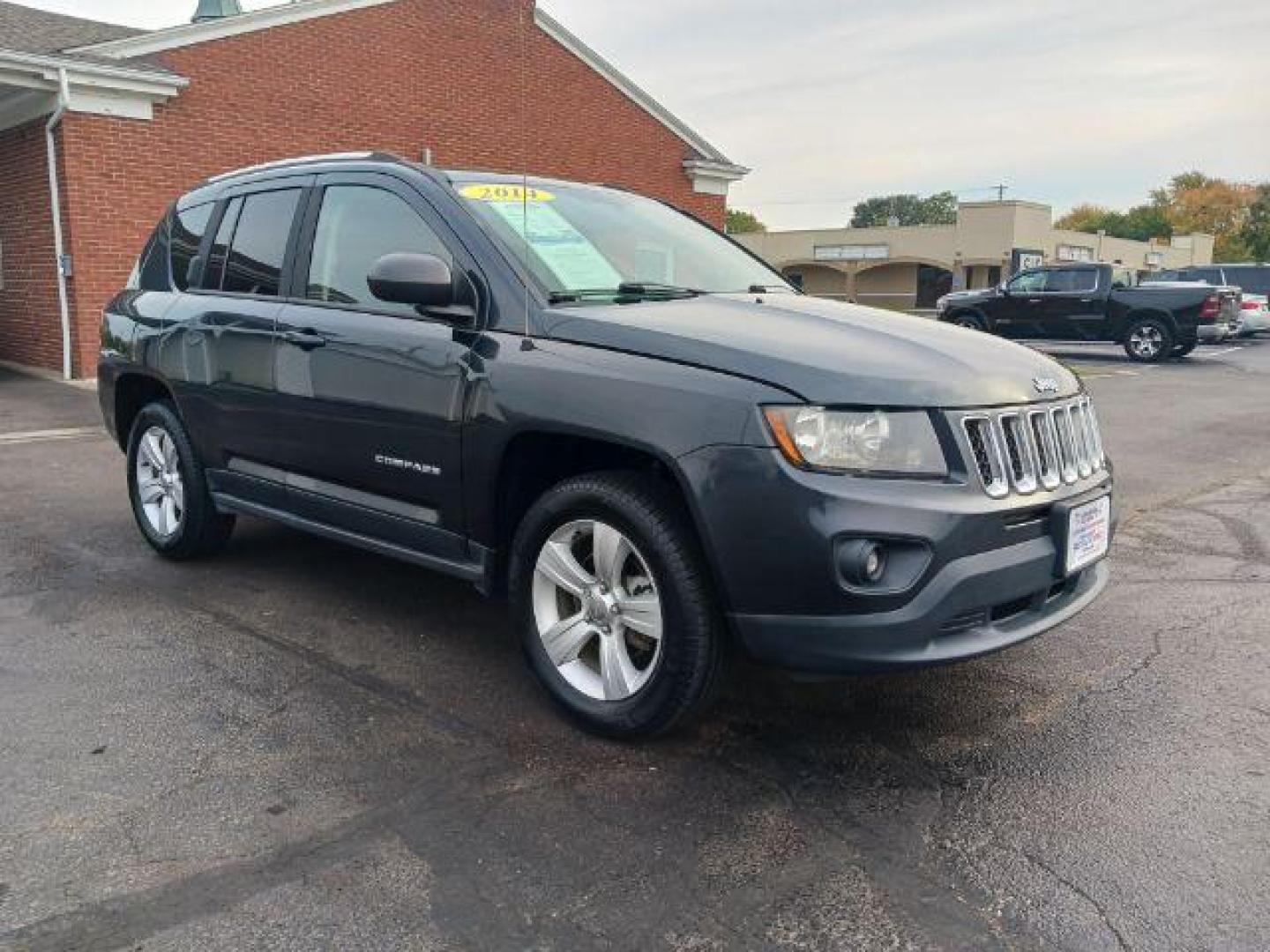 2014 Maximum Steel Metallic CC Jeep Compass Sport 4WD (1C4NJDBB5ED) with an 2.4L L4 DOHC 16V engine, located at 880 E. National Road, Vandalia, OH, 45377, (937) 908-9800, 39.892189, -84.181015 - Photo#0