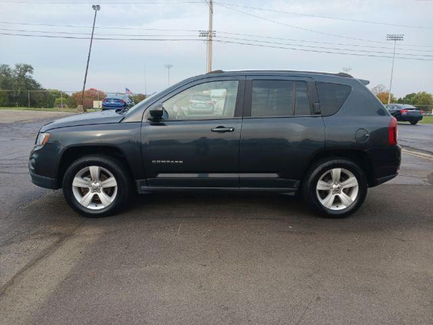 2014 Maximum Steel Metallic CC Jeep Compass Sport 4WD (1C4NJDBB5ED) with an 2.4L L4 DOHC 16V engine, located at 880 E. National Road, Vandalia, OH, 45377, (937) 908-9800, 39.892189, -84.181015 - Photo#3