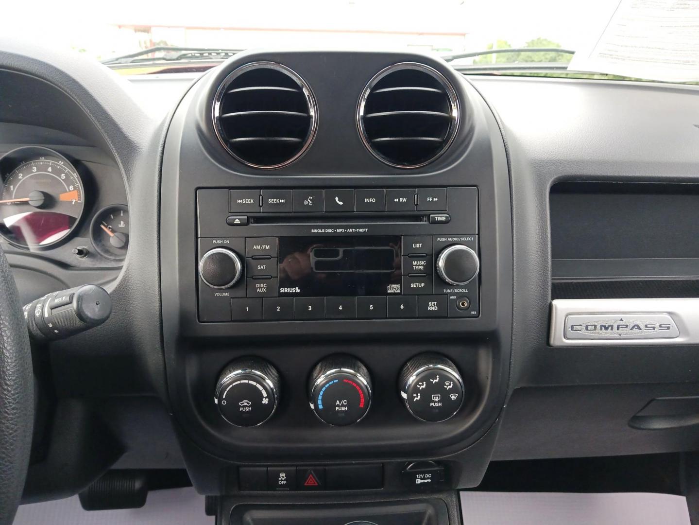 2014 Dp Cherry Red Crystal PC Jeep Compass Sport 4WD (1C4NJDBBXED) with an 2.4L L4 DOHC 16V engine, located at 1099 N County Rd 25A, OH, 45373, (937) 908-9800, 40.057079, -84.212883 - Photo#12