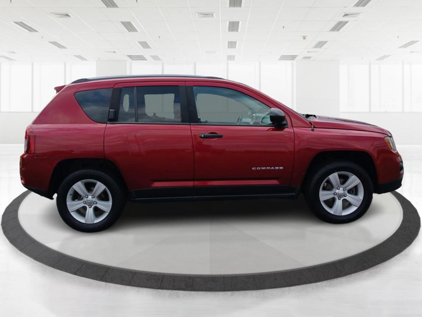 2014 Dp Cherry Red Crystal PC Jeep Compass Sport 4WD (1C4NJDBBXED) with an 2.4L L4 DOHC 16V engine, located at 1099 N County Rd 25A, OH, 45373, (937) 908-9800, 40.057079, -84.212883 - Photo#1