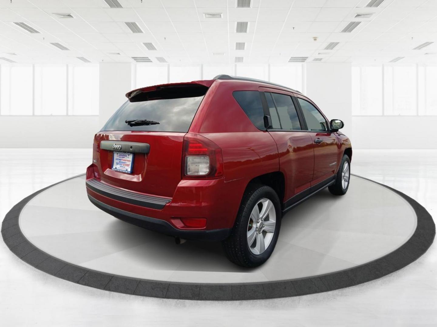 2014 Dp Cherry Red Crystal PC Jeep Compass Sport 4WD (1C4NJDBBXED) with an 2.4L L4 DOHC 16V engine, located at 1099 N County Rd 25A, OH, 45373, (937) 908-9800, 40.057079, -84.212883 - Photo#2