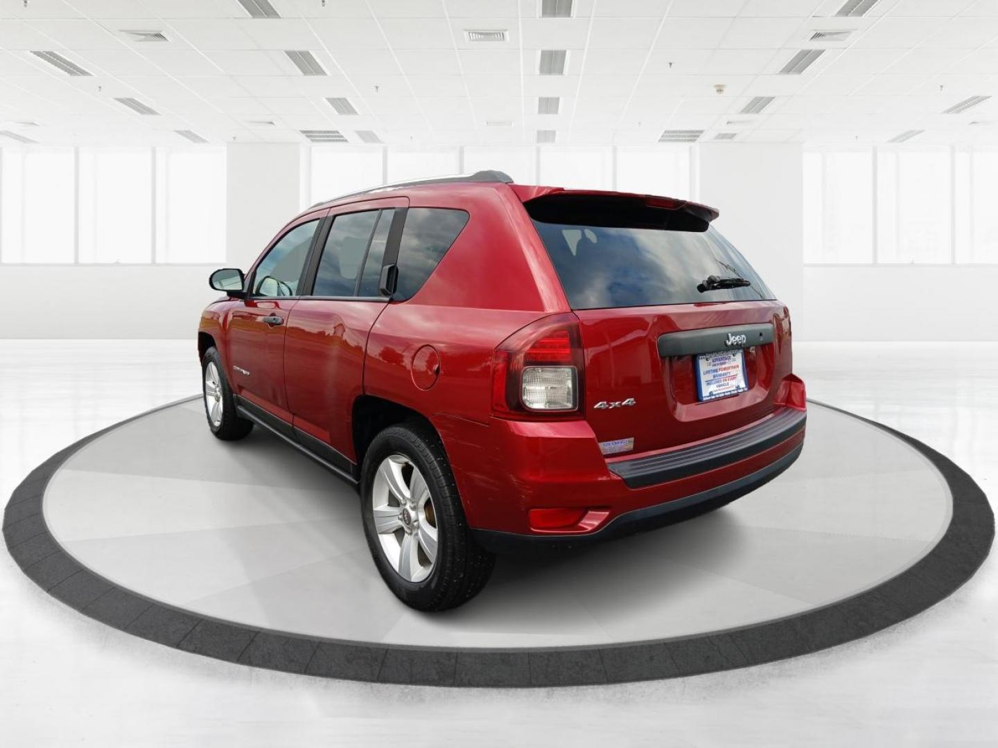 2014 Dp Cherry Red Crystal PC Jeep Compass Sport 4WD (1C4NJDBBXED) with an 2.4L L4 DOHC 16V engine, located at 1099 N County Rd 25A, OH, 45373, (937) 908-9800, 40.057079, -84.212883 - Photo#4