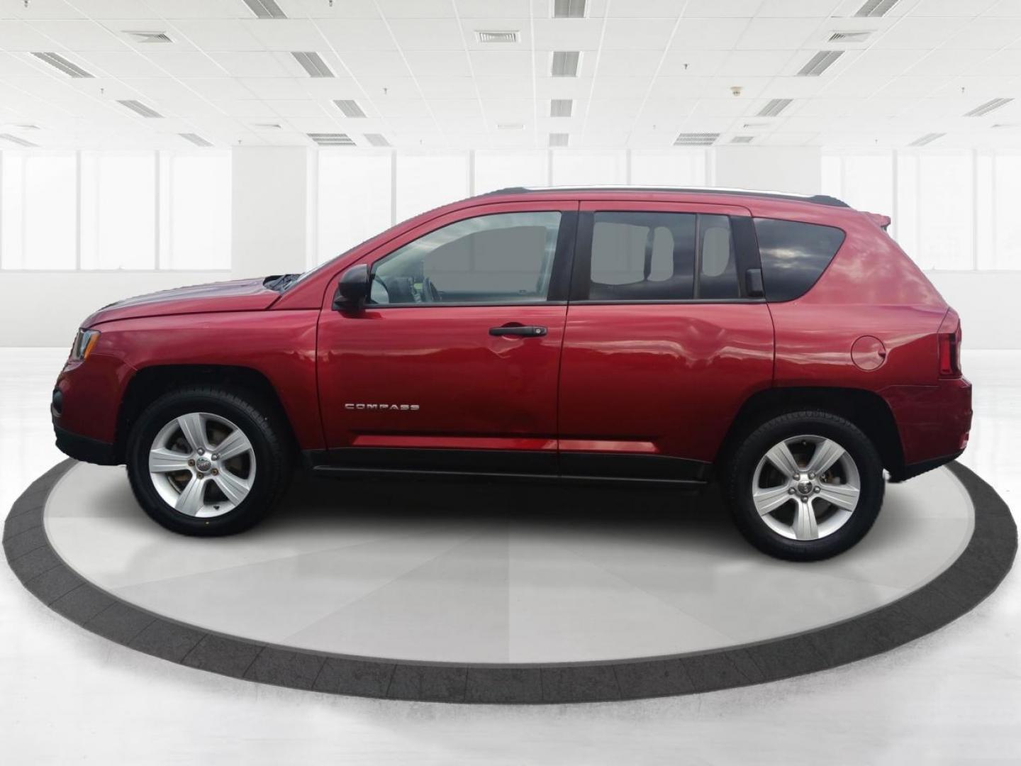 2014 Dp Cherry Red Crystal PC Jeep Compass Sport 4WD (1C4NJDBBXED) with an 2.4L L4 DOHC 16V engine, located at 1099 N County Rd 25A, OH, 45373, (937) 908-9800, 40.057079, -84.212883 - Photo#5